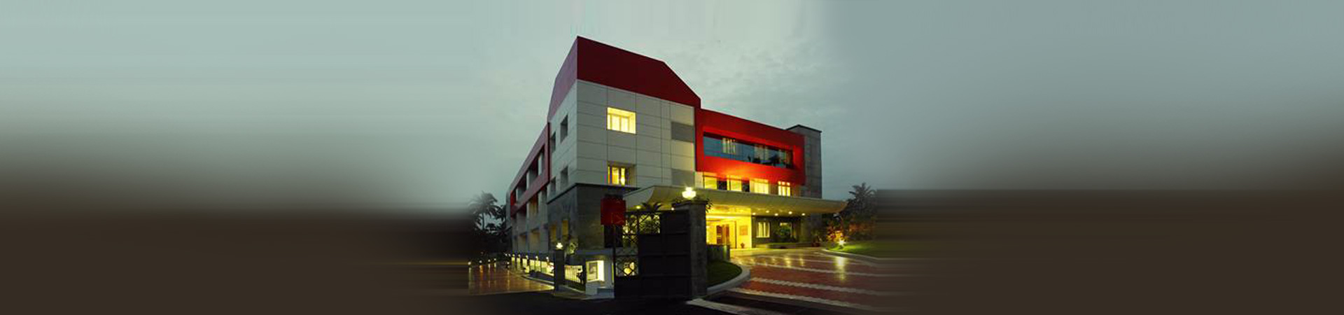 CIMAR The Women's Hospital, Kochi, lit up at dusk